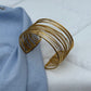 BRAZALETE LÍNEAS DORADO